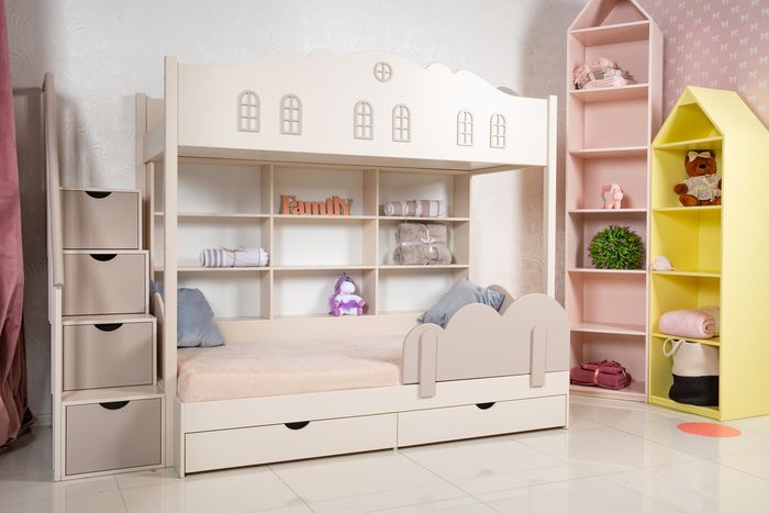 Unisex bedroom with a bunk bed with built-in shelves and drawers
