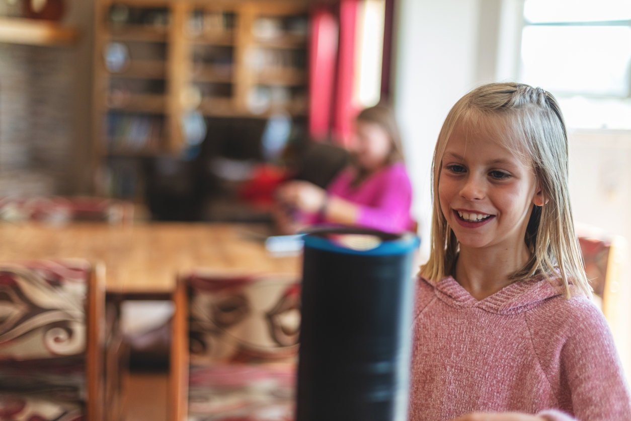 portable speaker with child in background
