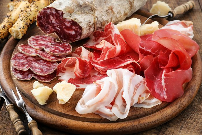 an Italian meat platter of thinly sliced prosciutto ham, bresaola, pancetta, and salami