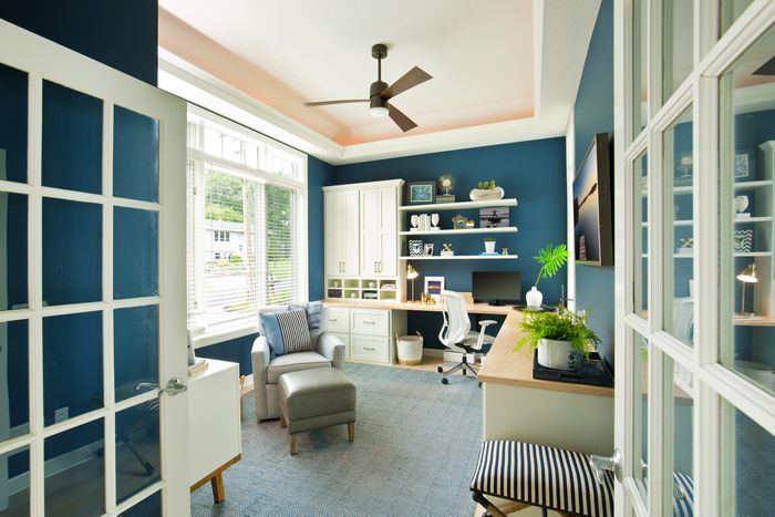 modern home office with a ceiling fan