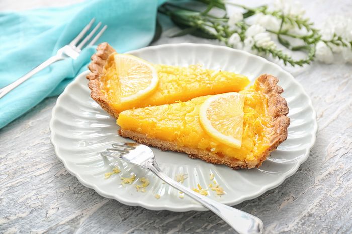 plate with pieces of arizona sunshine lemon pie on a rustic table