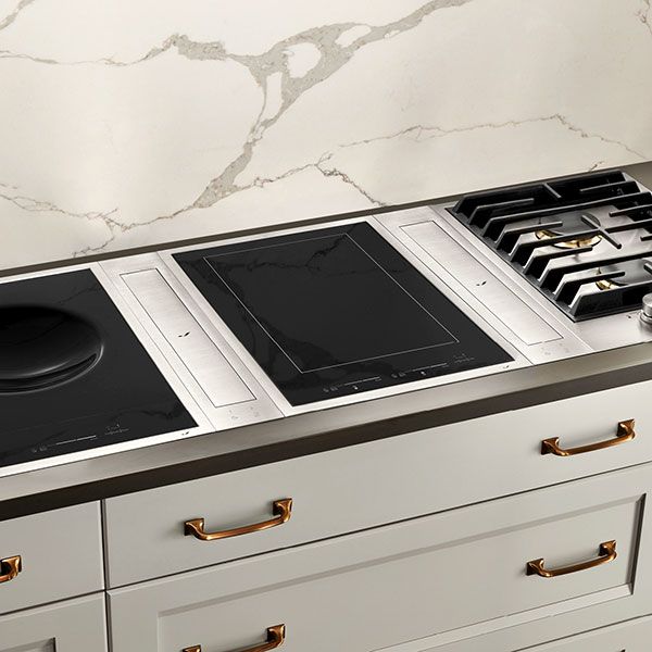 Compact Jenn-Air cooktop, built into a white countertop