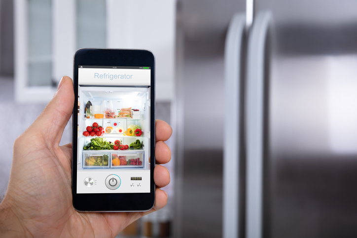 Smart phone screen displays contents of refrigerator