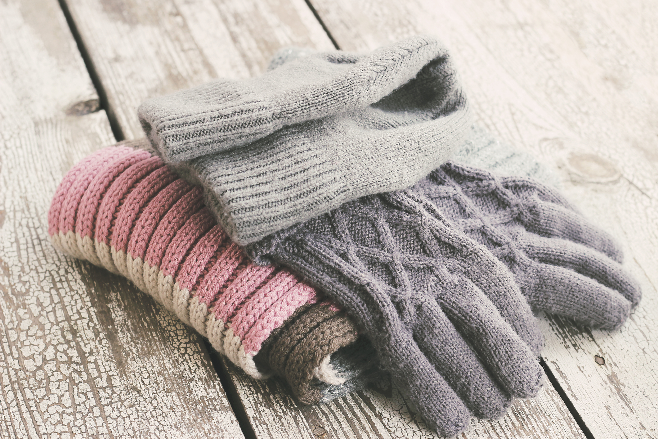 pile of knit hat, gloves, and scarf