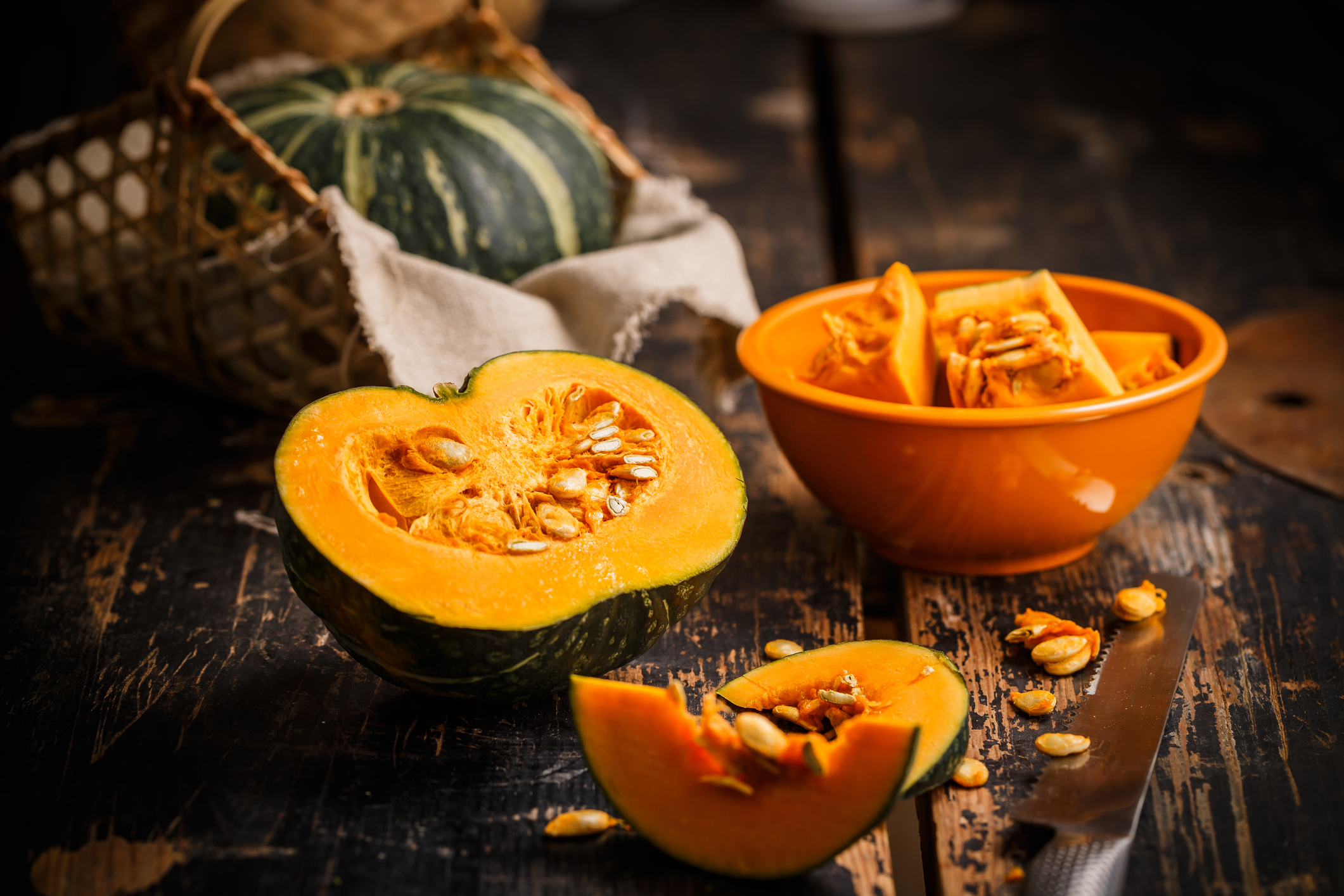 cutting fresh pumpkin for cooking