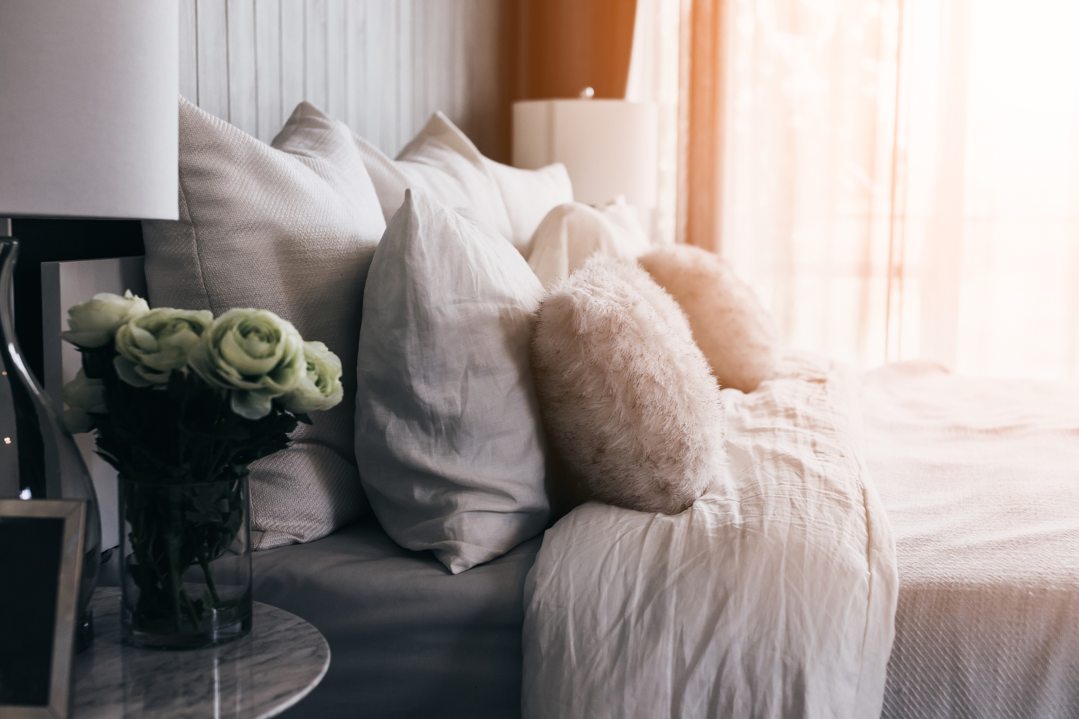 comfy bed with lots of pillows