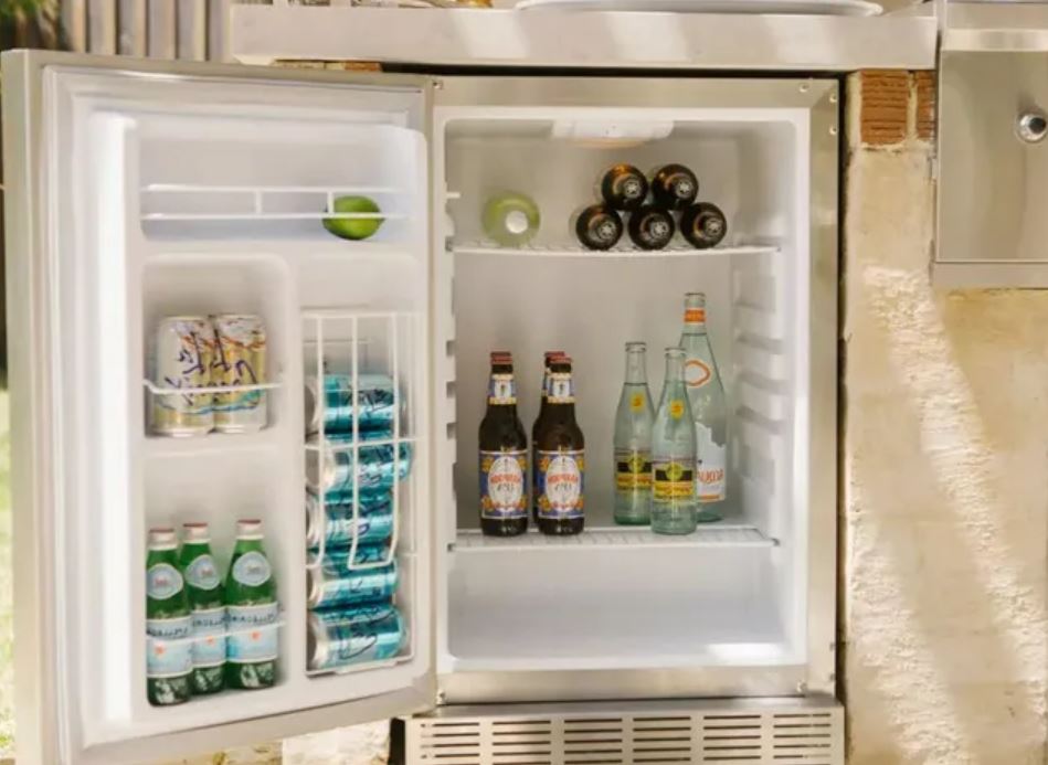 small open outdoor refrigerator with beverages inside