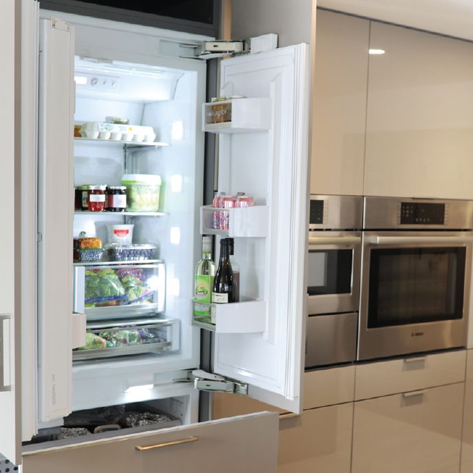 Bosch paneled refrigerator with doors open.