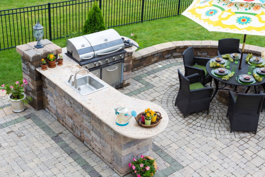 Outdoor kitchen with sink and BBQ