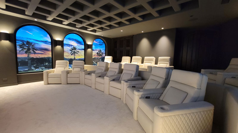 Theater room with two rows of white Fortress seating