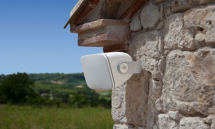 AM-1 outdoor speaker mounted on a stone wall
