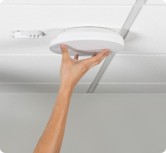 Hand Installing A Wireless Access into ceiling