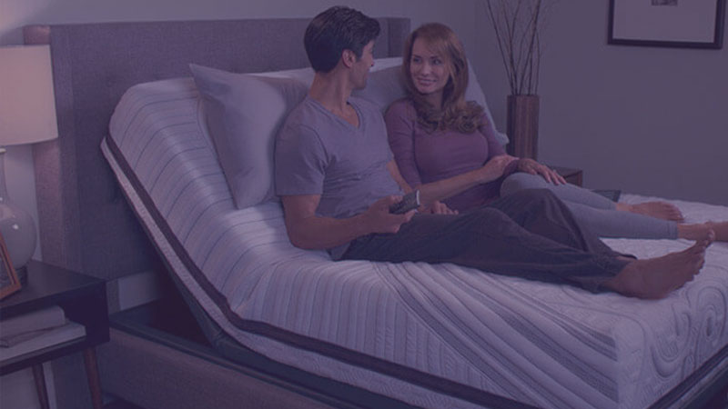 couple laying in adjustable bed
