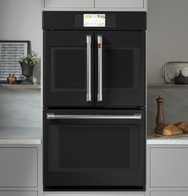Kitchen Featuring a Café Professional Series 30" Matte Black Double Electric Wall Oven