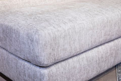 Signature Design by Ashley® Caretti Parchment Ottoman-1