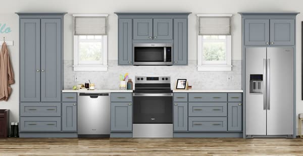 Kitchen featuring Whirlpool 4 Piece Kitchen Package-Stainless Steel with a built in dishwasher, microwave, electric range, and a refrigerator