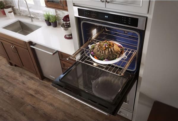 Kitchen showcasing KitchenAid 27" Stainless Steel Electric Built In Double Oven
