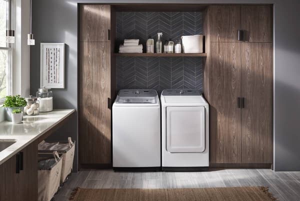 Laundry room featuring a white Samsung washer and dryer