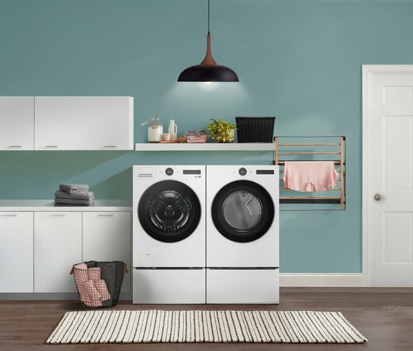 Laundry Room Featuring an LG 7.4 Cu. Ft. White Front Load Electric washer and Dryer