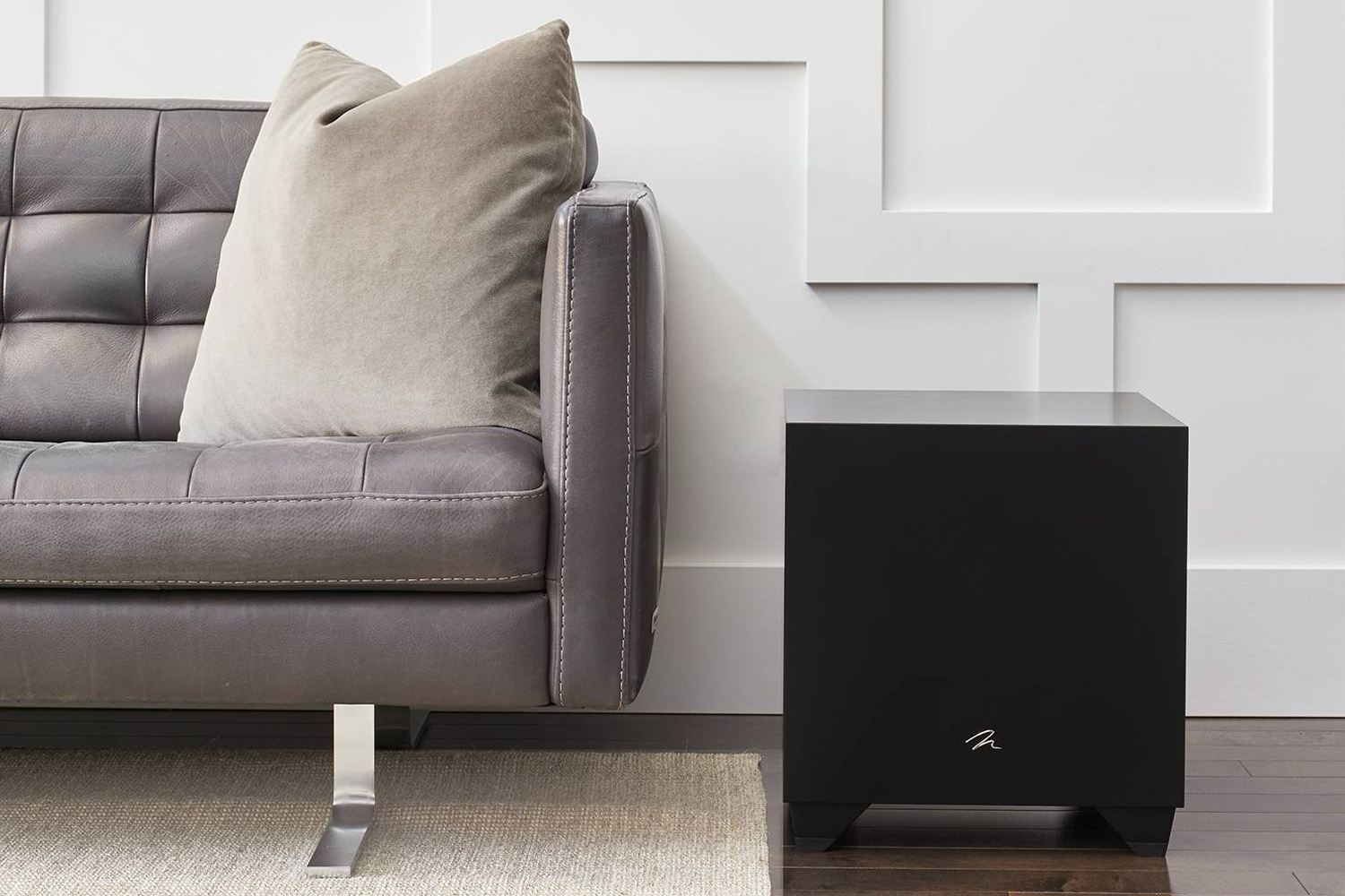 Dynamo Series on ground next to grey couch