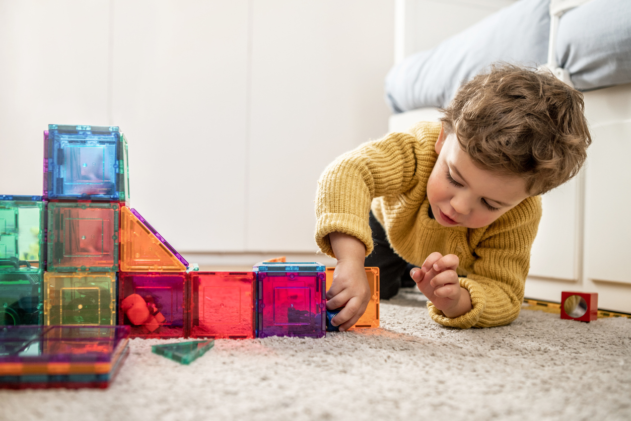  boy playing with toys