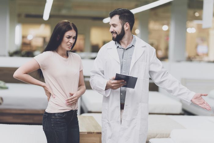 woman shopping for mattress