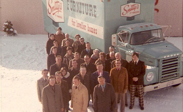Vintage photo of Smitty's team in front of delivery truck