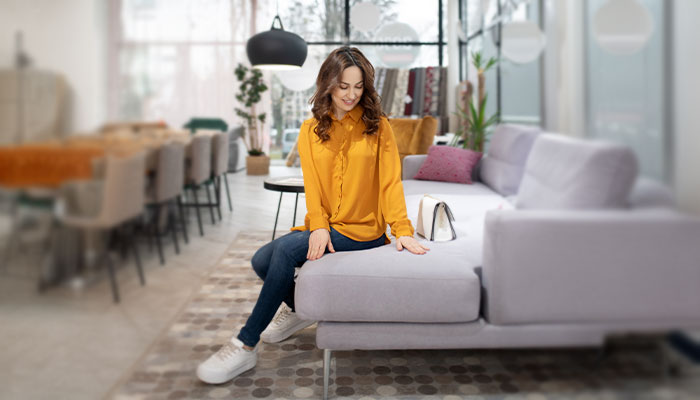 Woman feeling a furniture cushion
