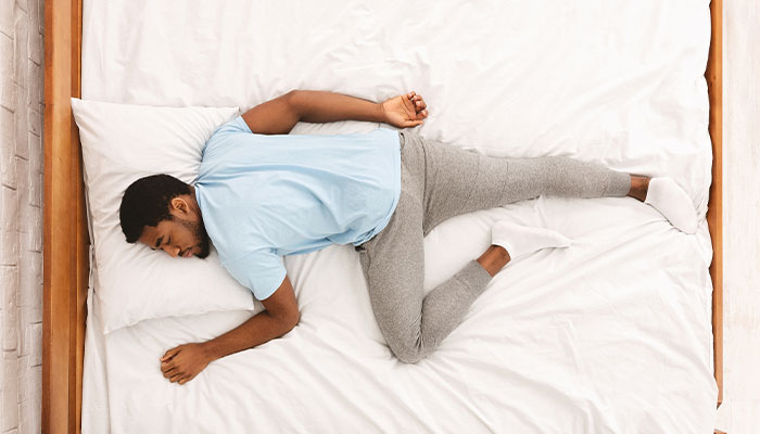 Man sleeping on his stomach