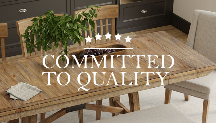 Committed to Quality text over a wooden dining room table set
