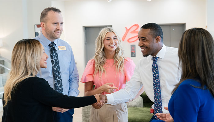 Group of people shaking hands