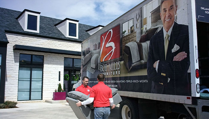 House with Bob Mills Delivery Truck and crew carrying furniture