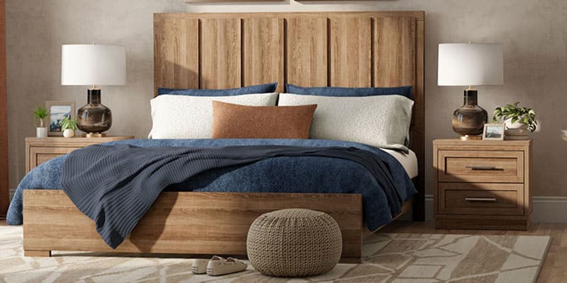 Upholstered bed with nightstands and a dresser in a bright, modern bedroom