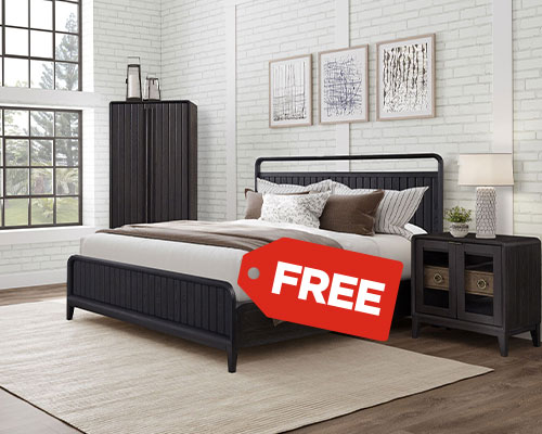 Bedroom with dark wood bed, nightstand, and wall art. A red