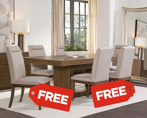 Wood dining table with six beige chairs in a bright room. Two red