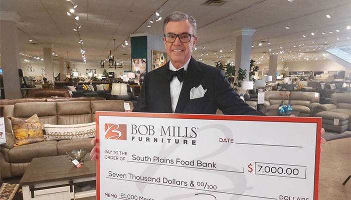 Bob Mills Holding Big Check