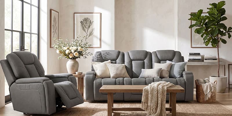 Gray reclining sofa and matching recliner in a bright, modern living room