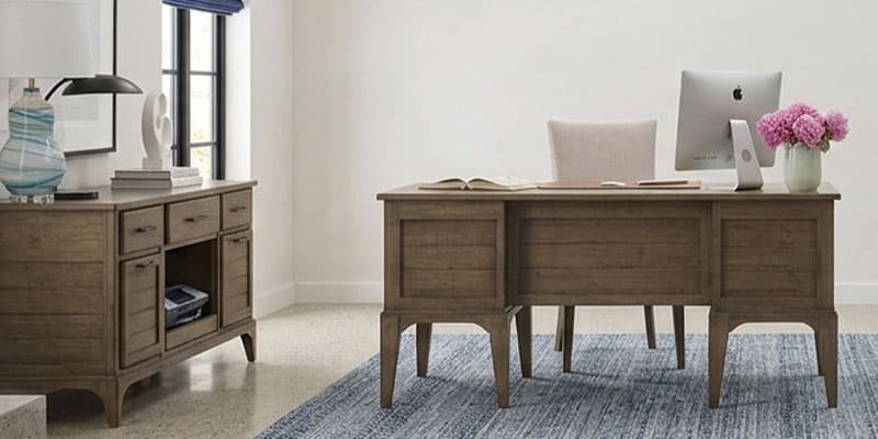 Home office with a desk, office chair, and bookcase