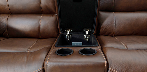 Brown leather recliner sofa close up with cup holders
