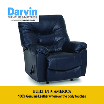 Freestanding hanging egg chair with a woven gray frame and light gray seat and back cushions, suspended from a curved black metal stand with a circular base. “Price Plunge” and “While Quantities Last!” promotional text appears along the bottom.