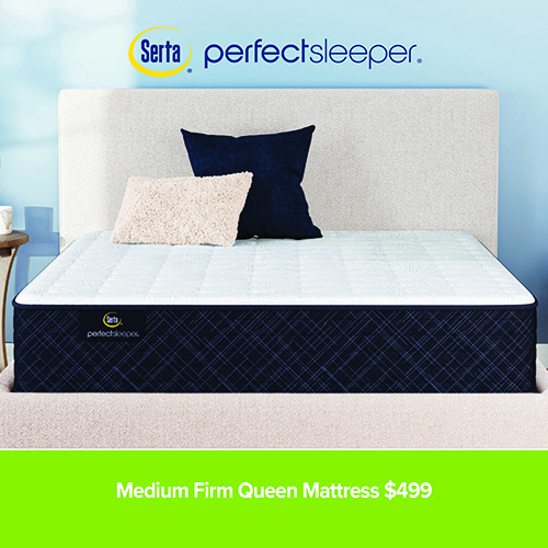 Queen-size Serta Perfect Sleeper mattress displayed on a bed with a light upholstered headboard and blue accent pillows against a soft blue wall. Text reads “Medium Firm Queen Mattress $499.”