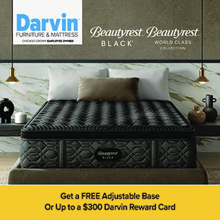 An advertisement for Darvin Furniture & Mattress featuring a Beautyrest Black mattress from the World Class Collection. The mattress has a premium black quilted design and is shown on a bed frame against a marble-patterned wall with gold pendant lights. A yellow banner at the bottom states: Get a FREE Adjustable Base Or Up to a $300 Darvin Reward Card.