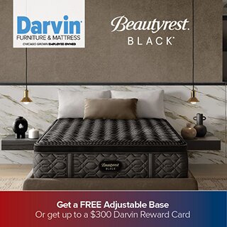 A promotional advertisement for Darvin Furniture & Mattress featuring a Beautyrest Black mattress. The mattress is shown in a modern bedroom setting with gold pendant lights and a marble accent wall. The bottom banner states: 'Get a FREE Adjustable Base Or get up to a $300 Darvin Reward Card'.