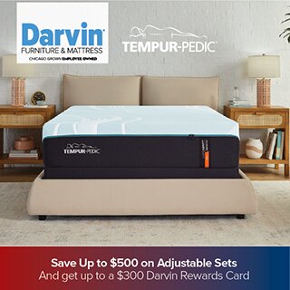 A promotional advertisement for Darvin Furniture & Mattress featuring a Tempur-Pedic mattress on a tan upholstered bed frame. The room has a bright, neutral aesthetic with wicker-detailed nightstands. The bottom banner states: 'Save Up to $500 on Adjustable Sets And get up to a $300 Darvin Rewards Card'.