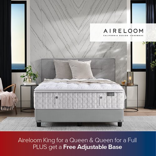 A promotional advertisement for Aireloom mattresses featuring a white handmade mattress in a high-end bedroom with marble walls and ocean views through the windows. The bottom banner reads 'Aireloom King for a Queen & Queen for a Full PLUS get a Free Adjustable Base'.