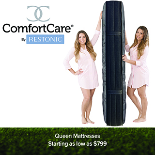 ComfortCare by Restonic logo above two women in pink pajamas holding a tall, rolled and compressed mattress bag between them. Text reads Queen Mattresses, Starting as low as $799.