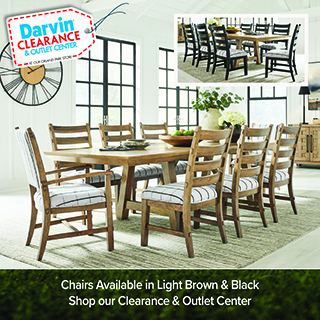 Darvin Clearance & Outlet Center logo, At our Grand Park Store, above a wood dining table with eight upholstered chairs in a striped pattern, floral centerpiece, in a room with large windows and a media console. Inset image shows a dark finish version of the same table and chairs. Text reads Chairs Available in Light Brown & Black, Shop our Clearance & Outlet Center.