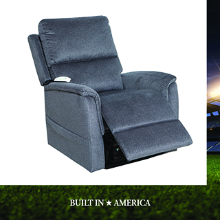 Gray fabric power lift recliner chair shown in a raised position, with a stadium image accent on the right edge. Text reads BUILT IN AMERICA.