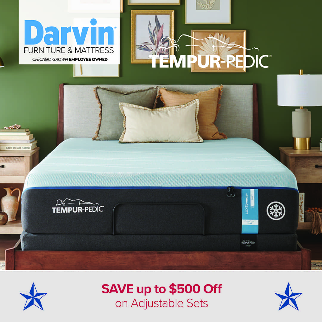 Tempur-Pedic mattress with a light blue top and dark base in a bedroom with green walls, framed artwork, and wooden furniture. Text reads: “Darvin Furniture & Mattress – Tempur-Pedic – SAVE up to $500 Off on Adjustable Sets,” with blue stars on each side.