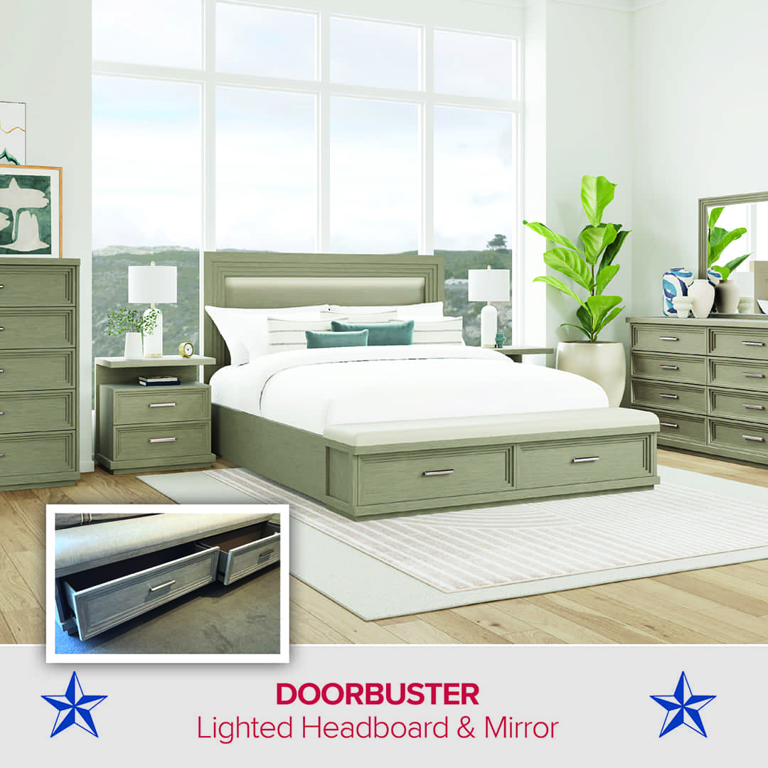 Contemporary bedroom featuring a light wood bed frame with built-in storage drawers and a lighted headboard. The room includes matching nightstands, a dresser with mirror, and a tall chest of drawers. The decor features white bedding, teal accent pillows, lamps, and green plants near large windows that let in natural light. An inset image highlights the bed’s underframe storage drawers. Text at the bottom reads: “DOORBUSTER – Lighted Headboard & Mirror,” with blue stars on each side.